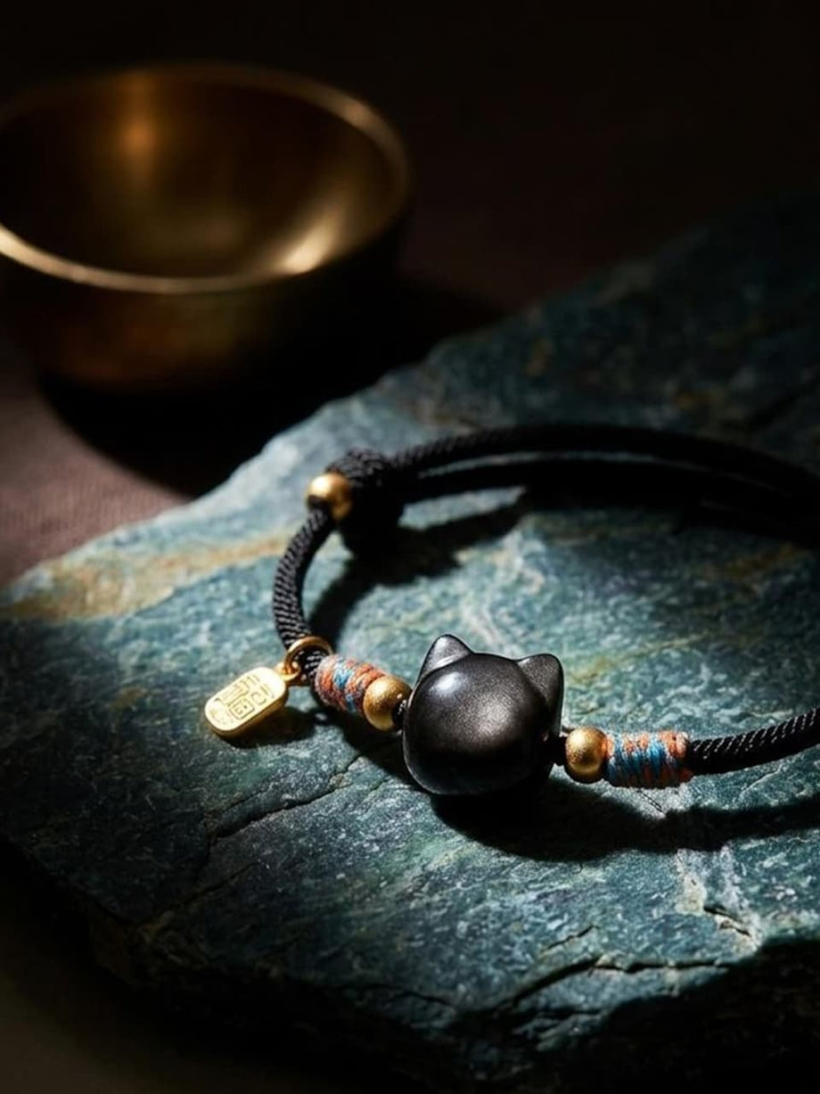 Black obsidian cat-bead bracelet with a braided cord - JuJuBit