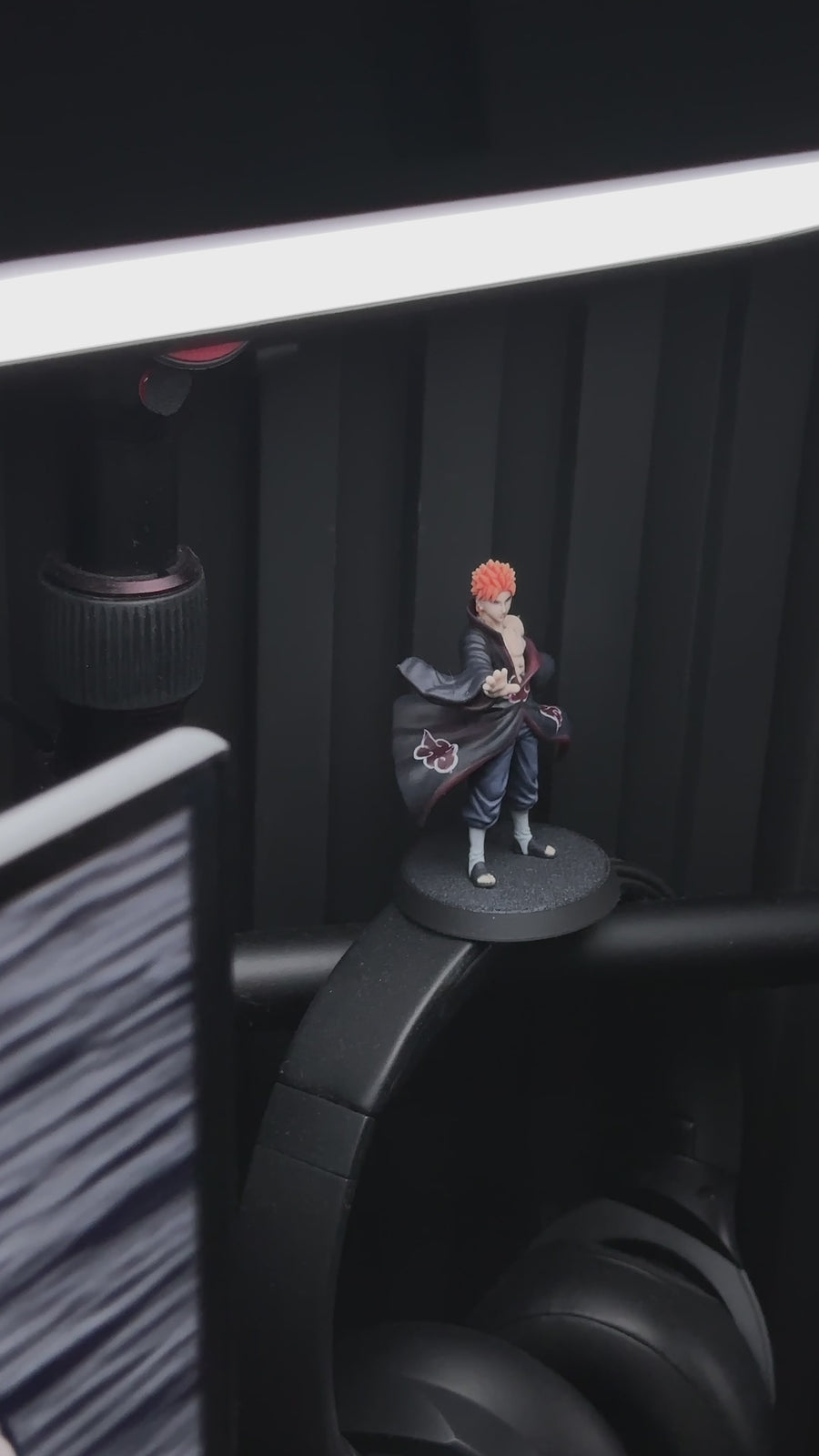 Custom anime figurine with orange hair and a red-cloud cloak on a gaming desk, beside a JuJuBit "Custom TRPG Miniature" product page - JuJuBit