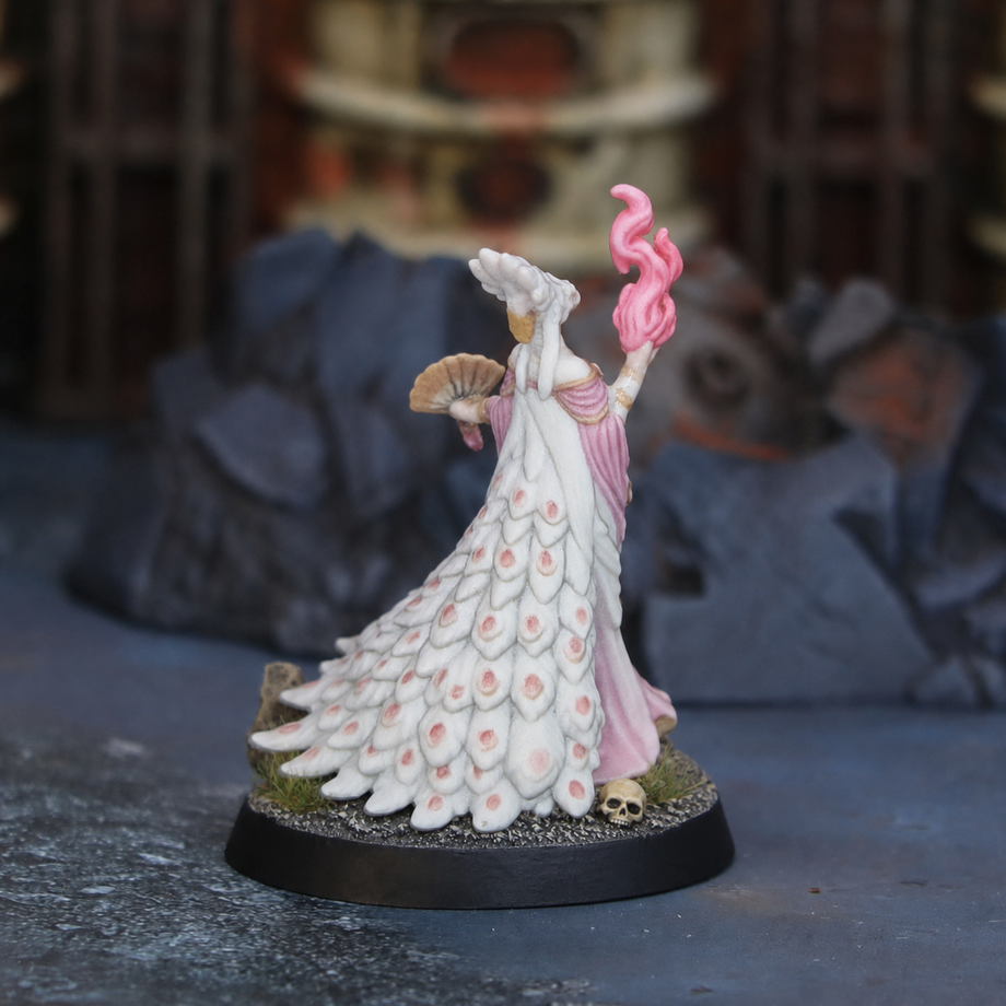 Custom sorceress figurine in a feathered gown holding a pink flame - JuJuBit